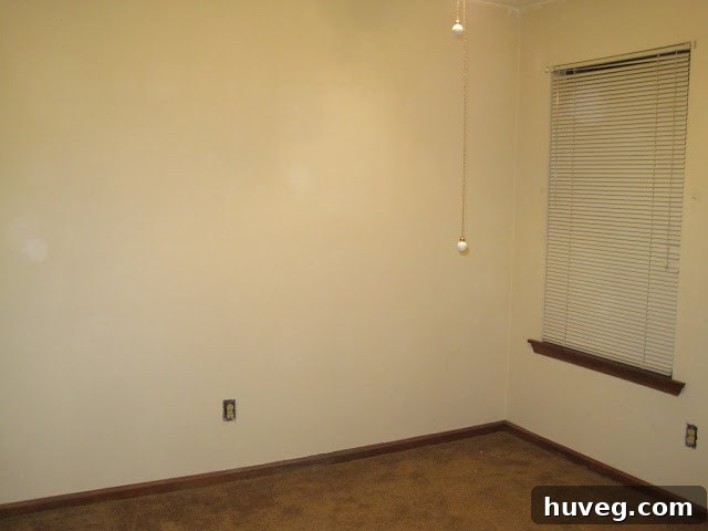 Empty craft room with freshly painted walls, awaiting furniture and organization