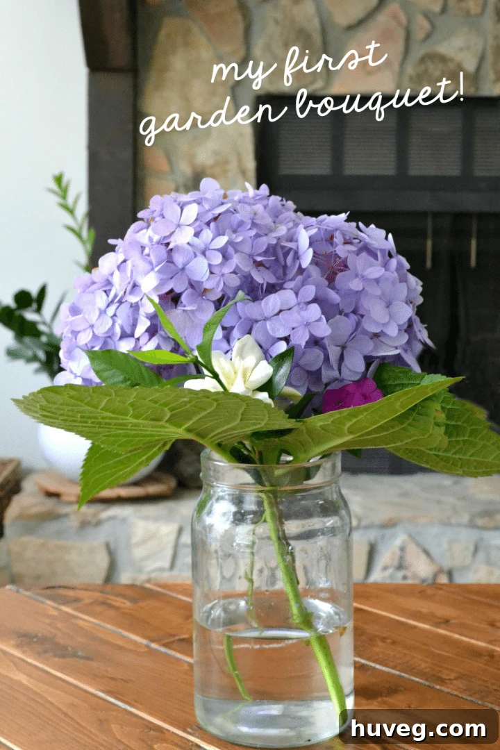 Stunning homemade hydrangea bouquet with delicate gardenia and vibrant phlox in a rustic vase, captured in soft natural light.