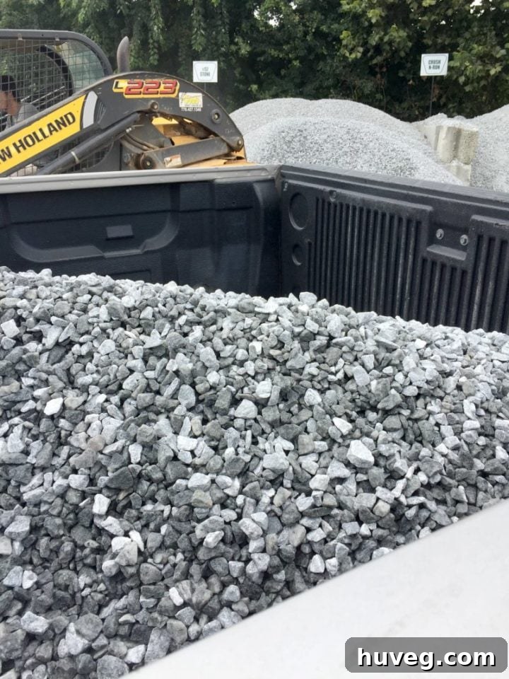 Truck bed loaded with bulk crushed granite gravel