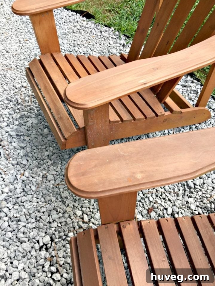 Newly laid gravel around Adirondack chairs creating a defined outdoor seating area