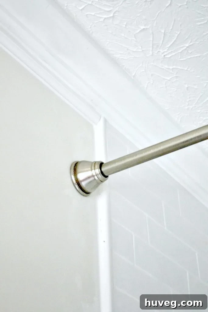 Seamless transition from shower tile to drywall with crown molding