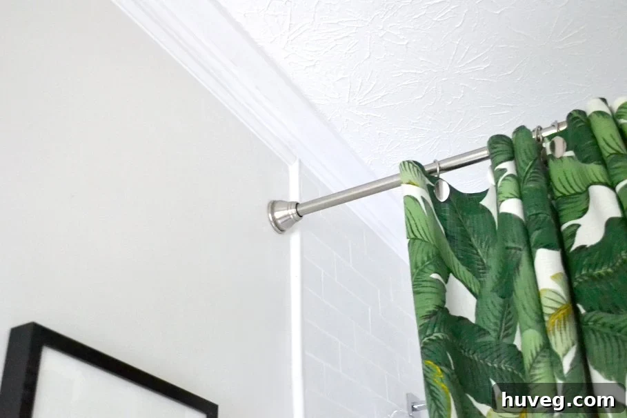 Finished shower tile and crown molding in a beautiful bathroom