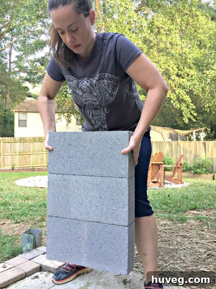 Demonstrating the exceptional strength of Krazy Glue by lifting glued concrete blocks