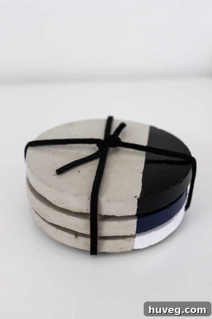 Handmade concrete coasters arranged artfully, showcasing their modern and versatile design.