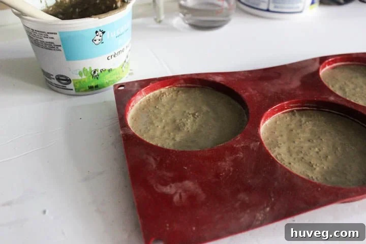 Pour smooth concrete mixture into molds and tap gently to flatten and remove air bubbles.