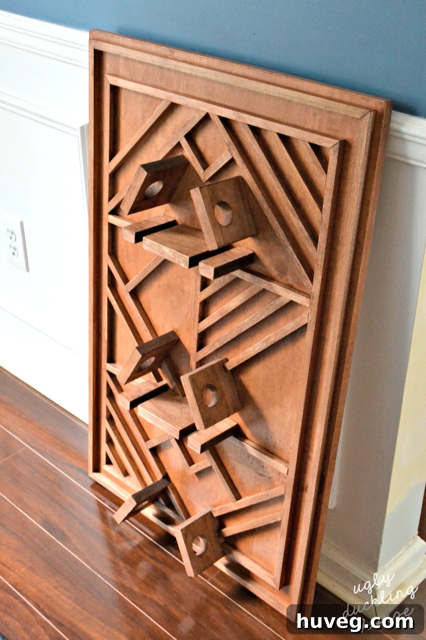 Finished plywood art wine rack before wall mounting