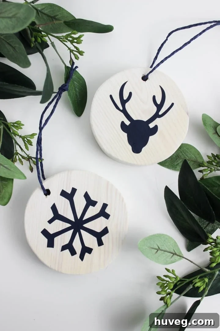 White washed wooden reindeer ornament with intricate design