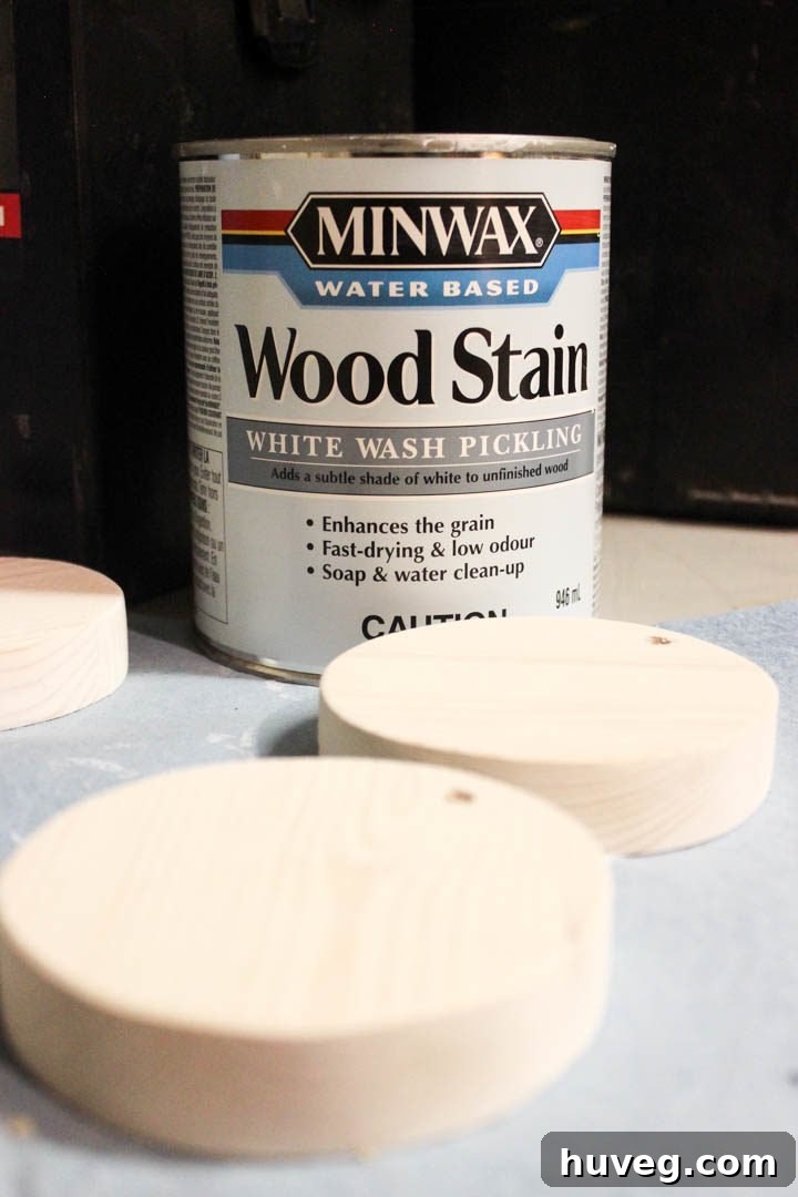 Applying whitewash wood stain to a wooden ornament