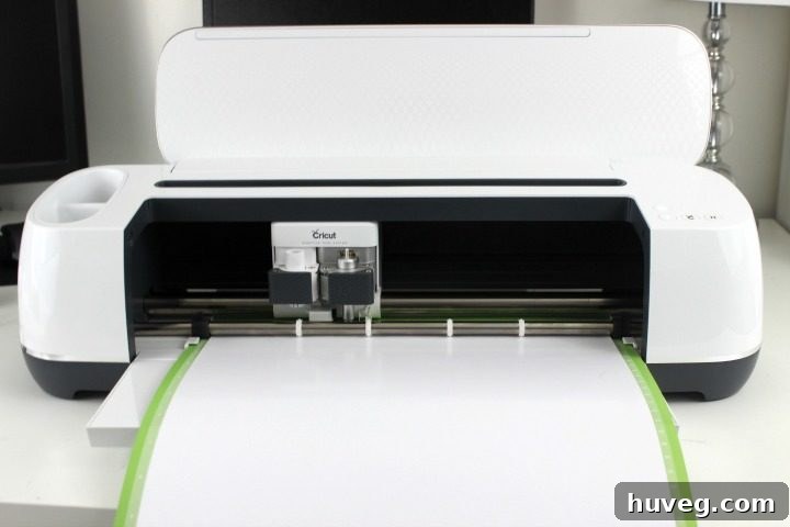Cricut Maker cutting iron-on vinyl for ornament designs