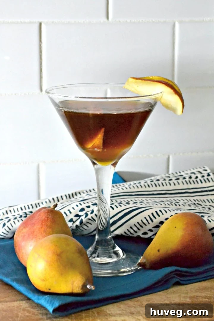 A festive Spiced Pear Manhattan, perfect for fall celebrations