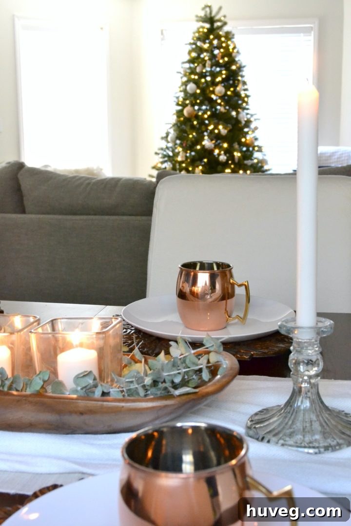 Tablescape with Christmas tree in the background