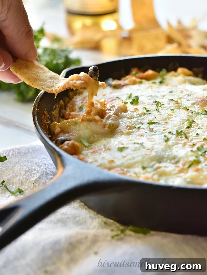 Close-up of bubbling chicken enchilada dip