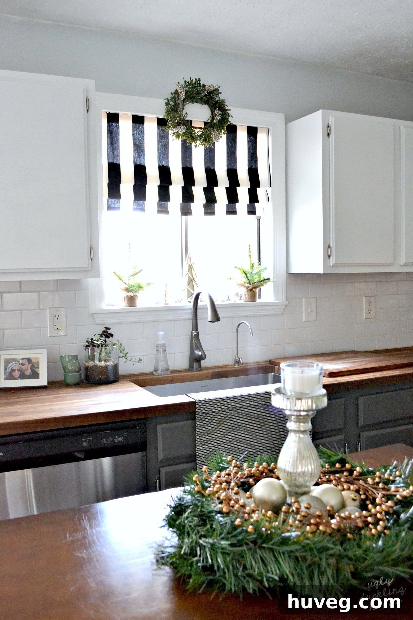 Charming woodland neutral Christmas kitchen decorated with subtle gold, silver, and white accents, creating a serene holiday atmosphere.