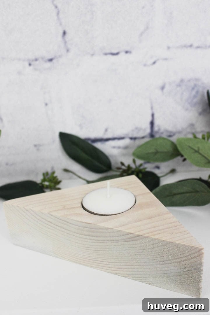 A stylish trio of triangle tea light holders in contrasting finishes, illustrating their customizable nature as decorative elements.