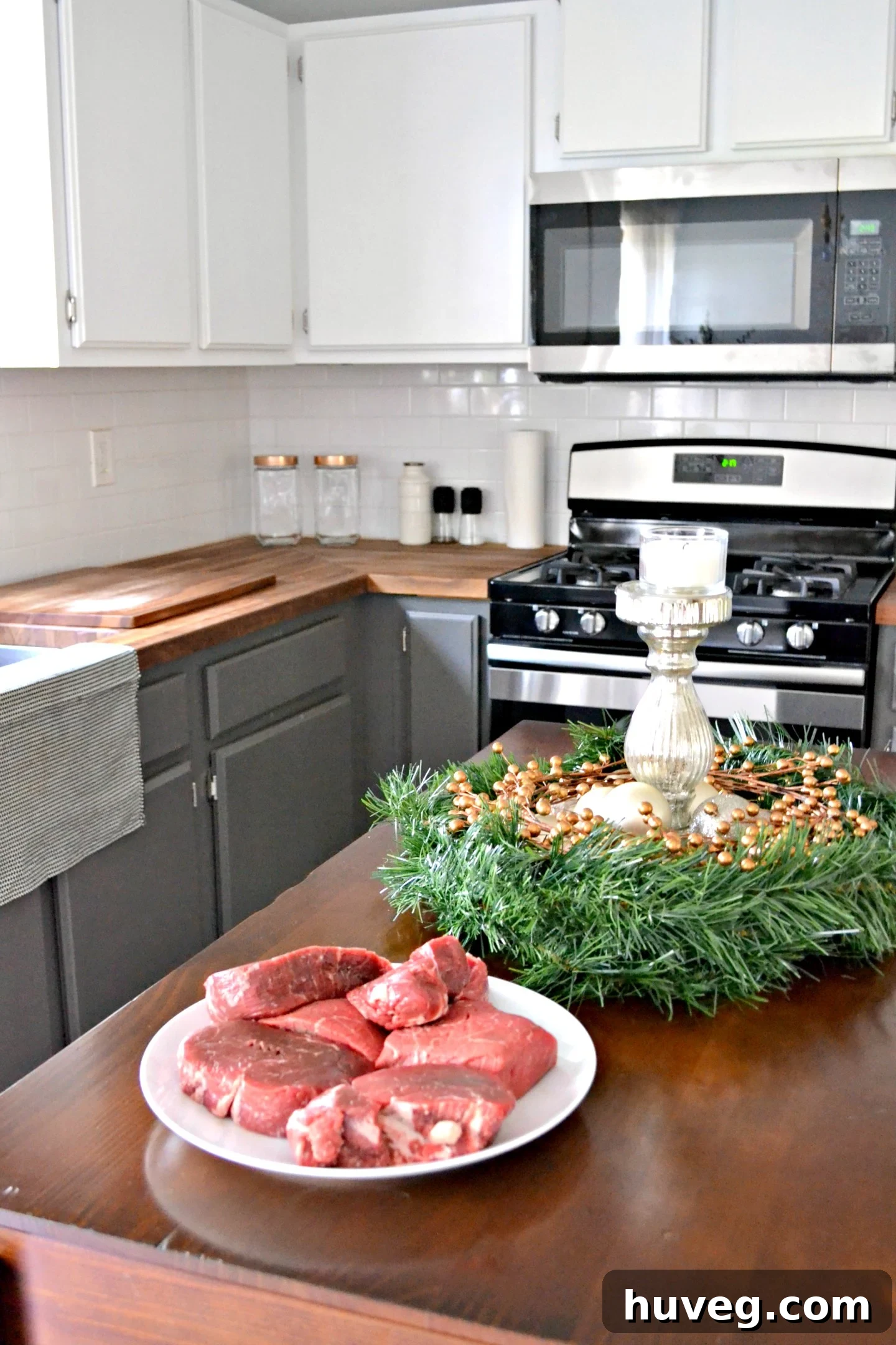 Delicious steaks cooking in the kitchen, indicating a festive and well-prepared Christmas dinner.