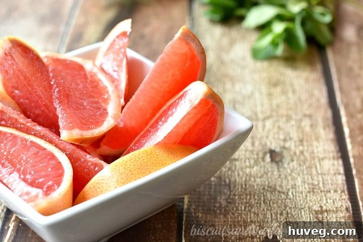 Close-up of Grapefruit Moscow Mules being prepared in a cocktail shaker.