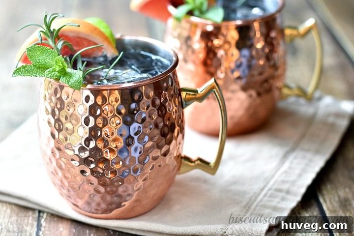 Grapefruit Moscow Mules in copper mugs, ready to be served.