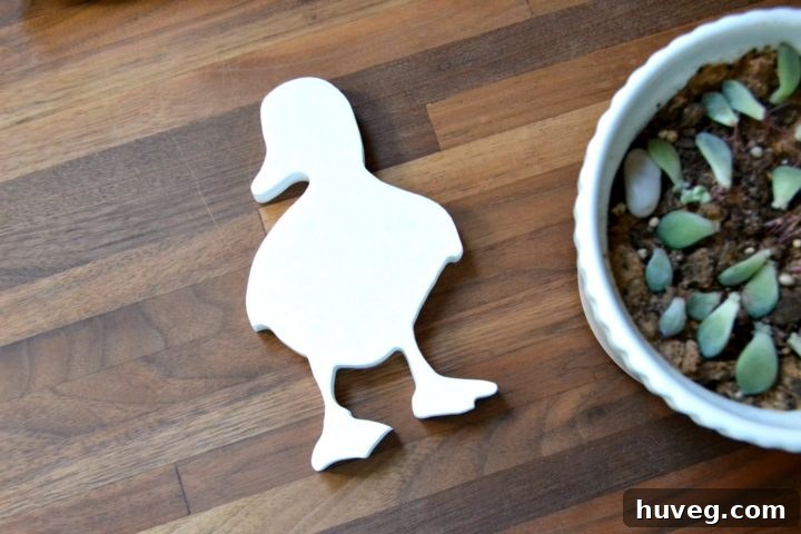 duckling logo cut from corian with cnc machine