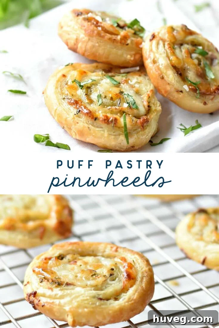 An overhead shot of puff pastry pinwheels, some on a cooling rack and others artfully arranged on a white tablecloth, highlighting their appealing spiral design.
