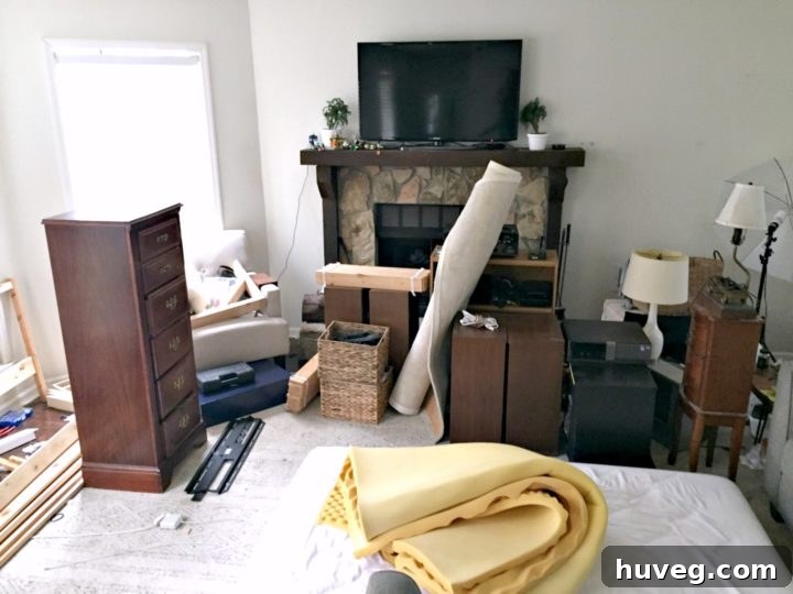 living room full of guest bedroom stuff