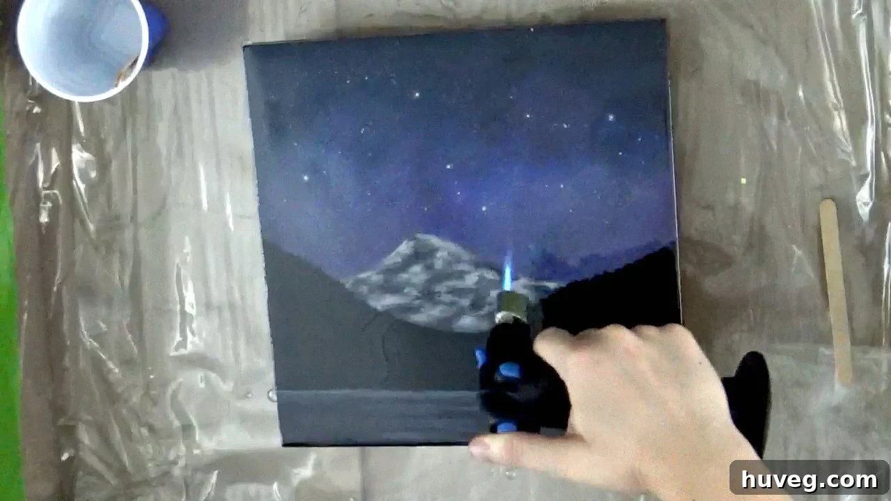 using torch to help pop air bubbles in resin