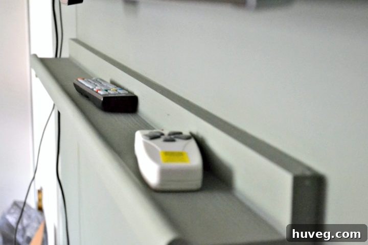 ledge for remotes under tv
