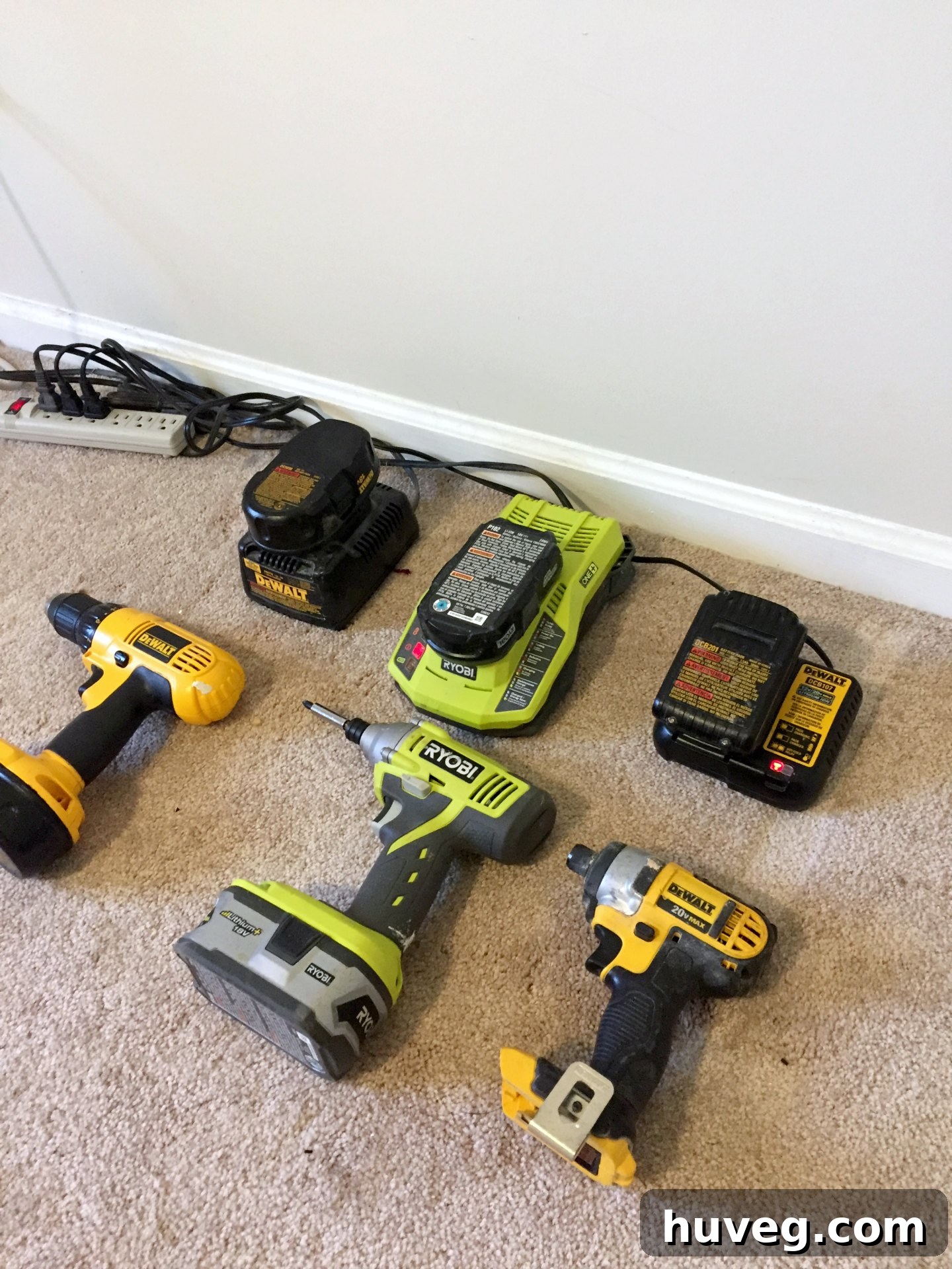 Tools charging in the garage, showing initial progress with organization.