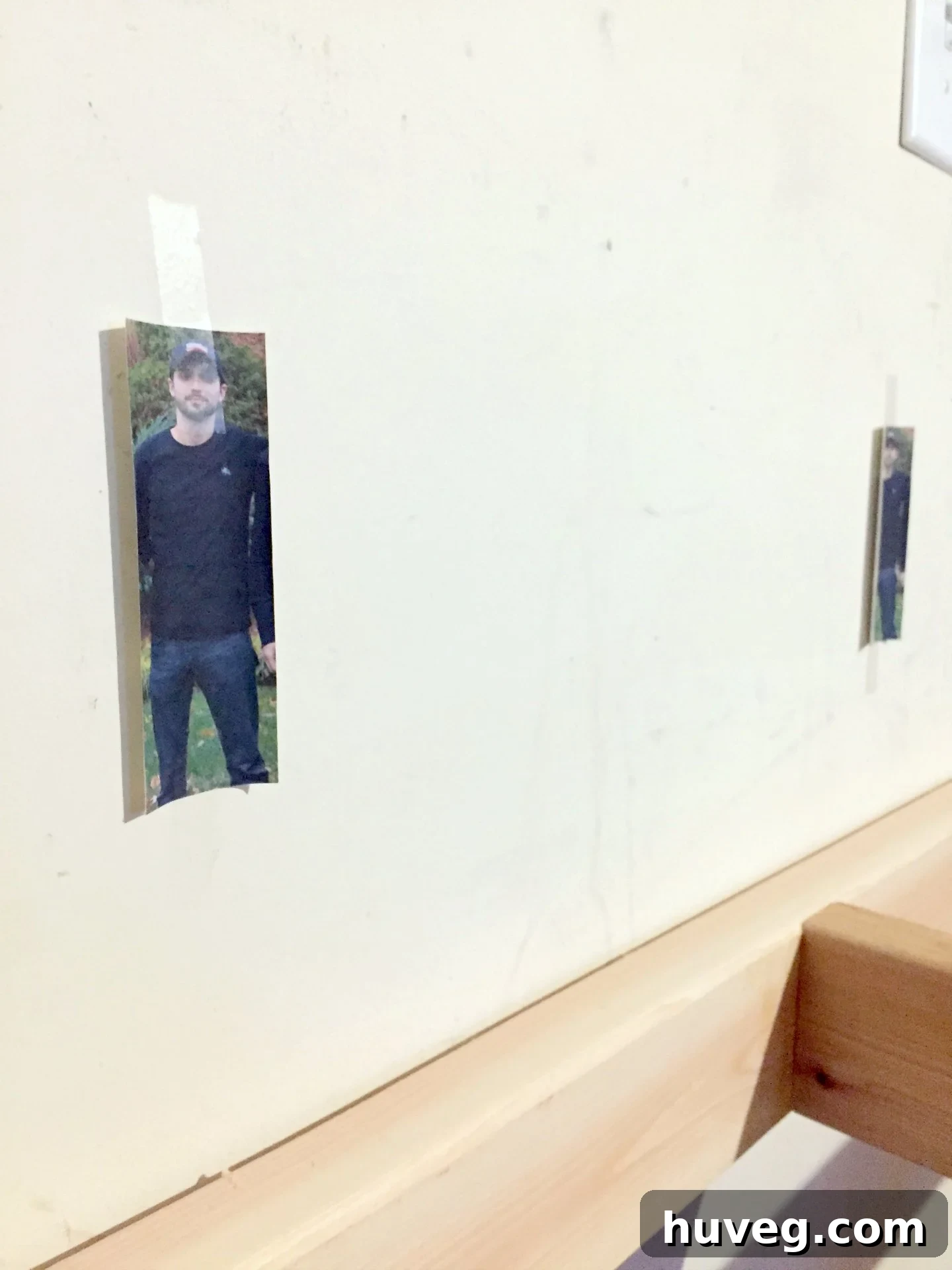 Hilarious stud finder prank with printed faces marking wall studs.