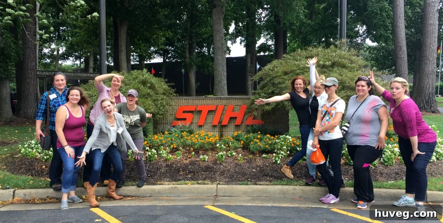 Group photo of women influencers at STIHL Women's Summit, dressed in safety orange