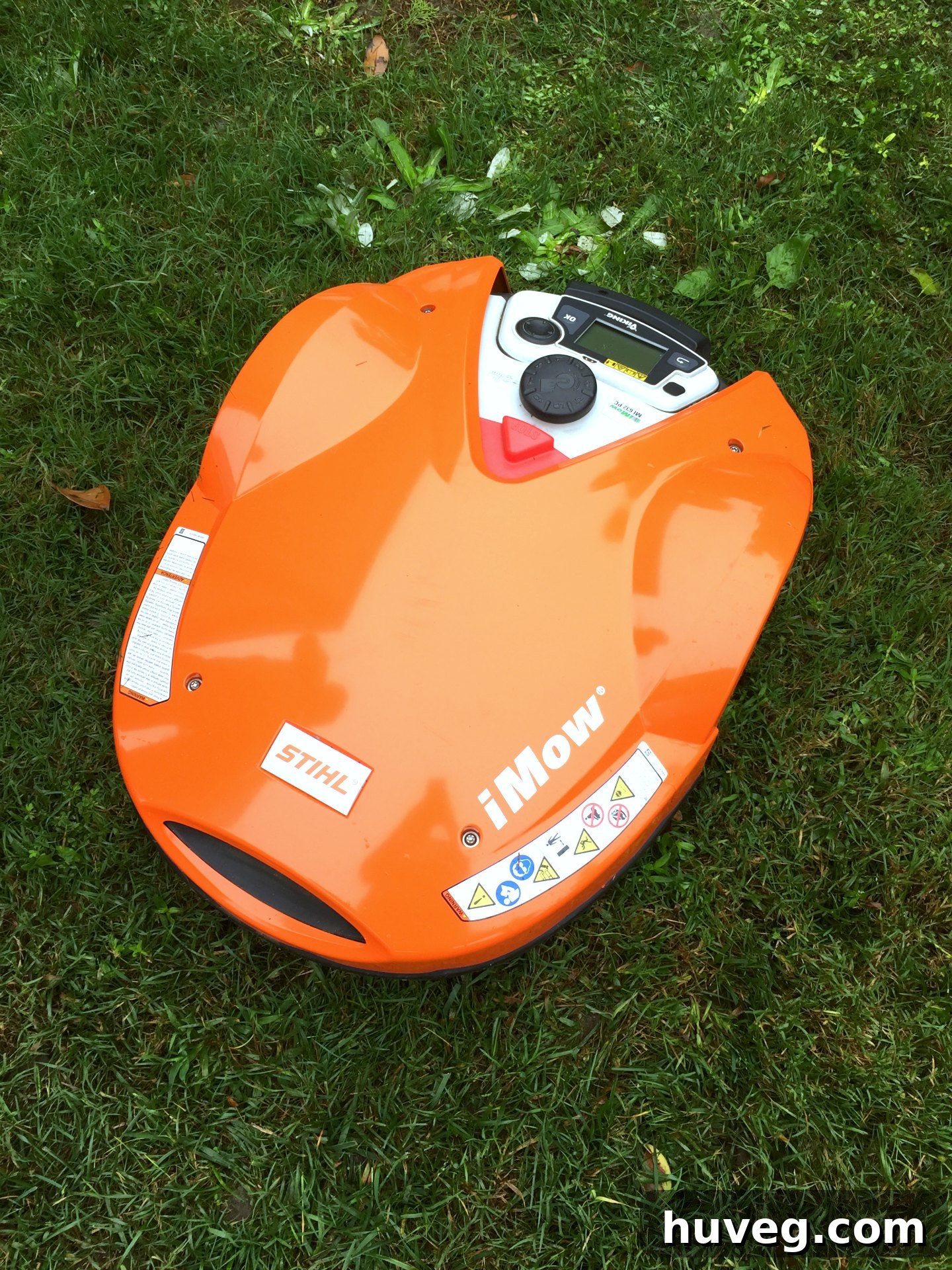 STIHL iMow robotic lawn mower operating autonomously in a garden