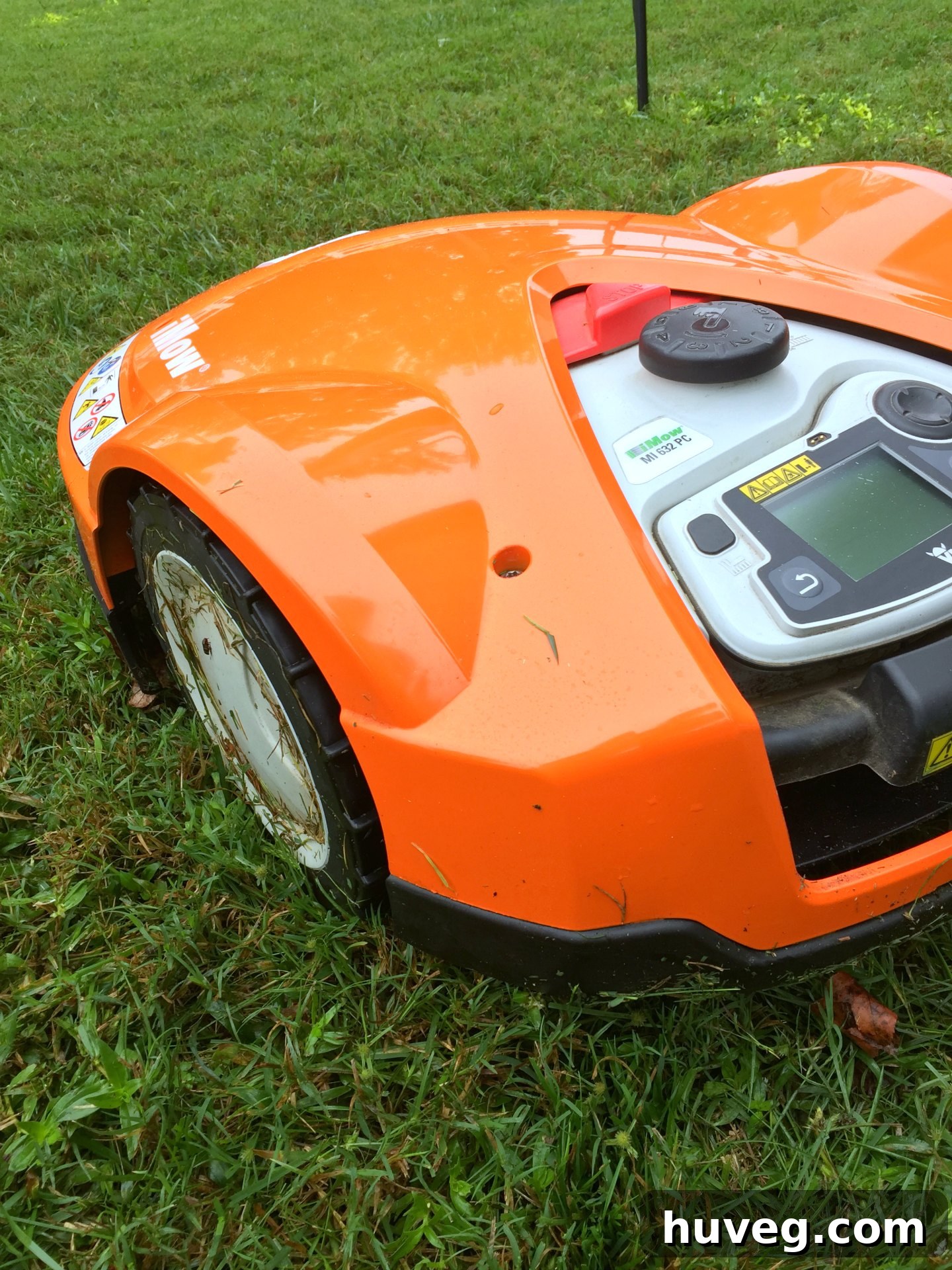 Close-up of STIHL iMow robotic lawn mower with advanced sensors