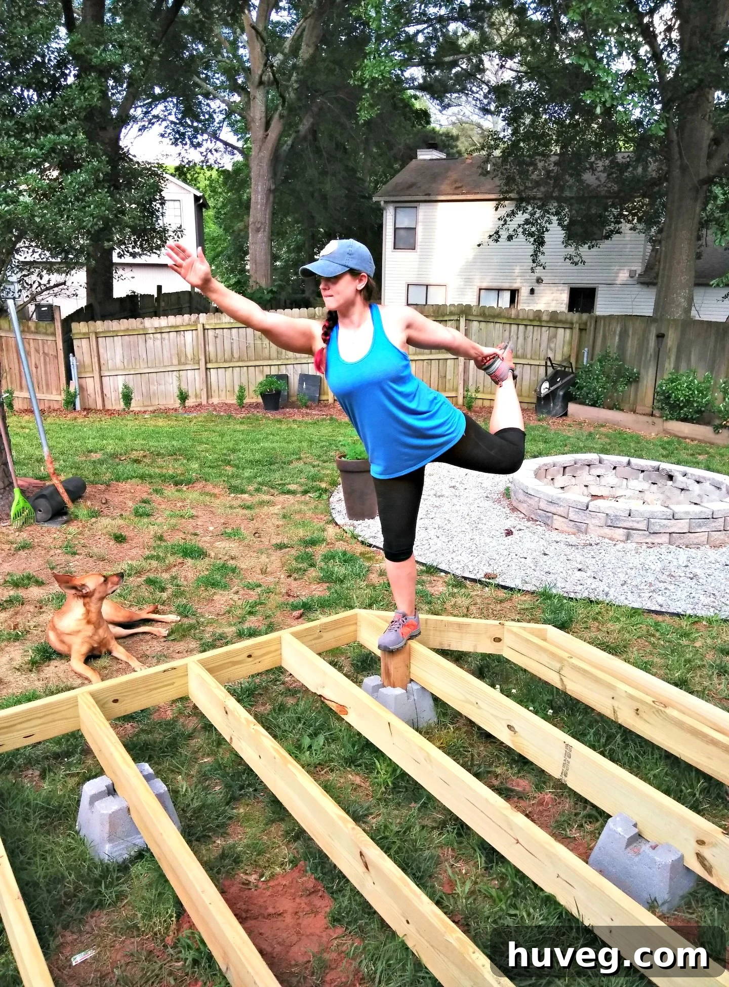 A humorous image of someone doing 'bad deck yoga' in celebration of a completed construction step.
