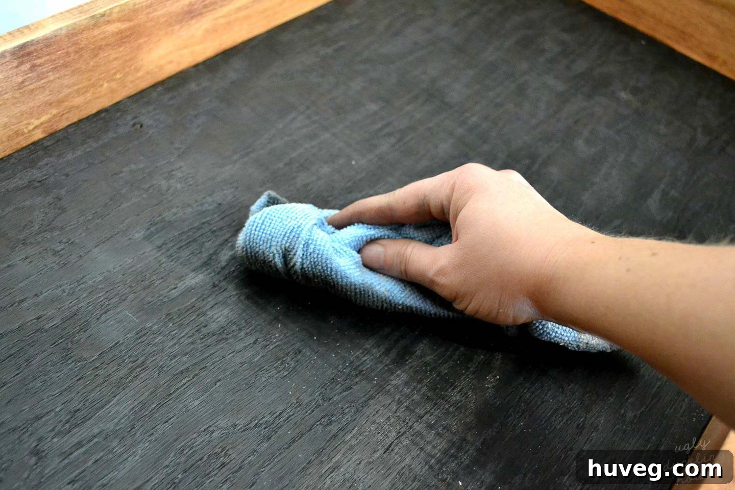 Wipe down the shou sugi ban charred wood with a cloth to remove any residue