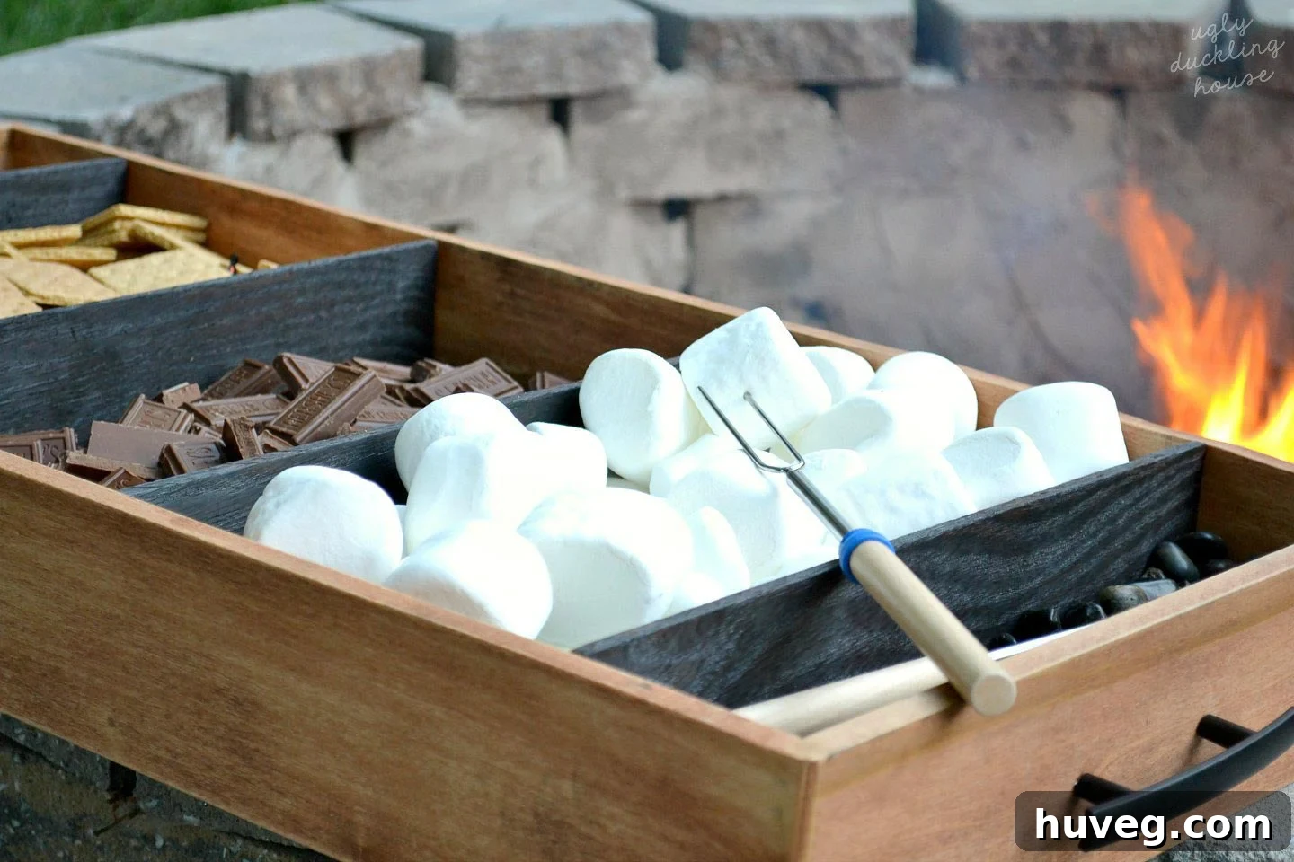 Using my shou sugi ban s’mores tray by the fire, with marshmallows and cute roasting sticks. 