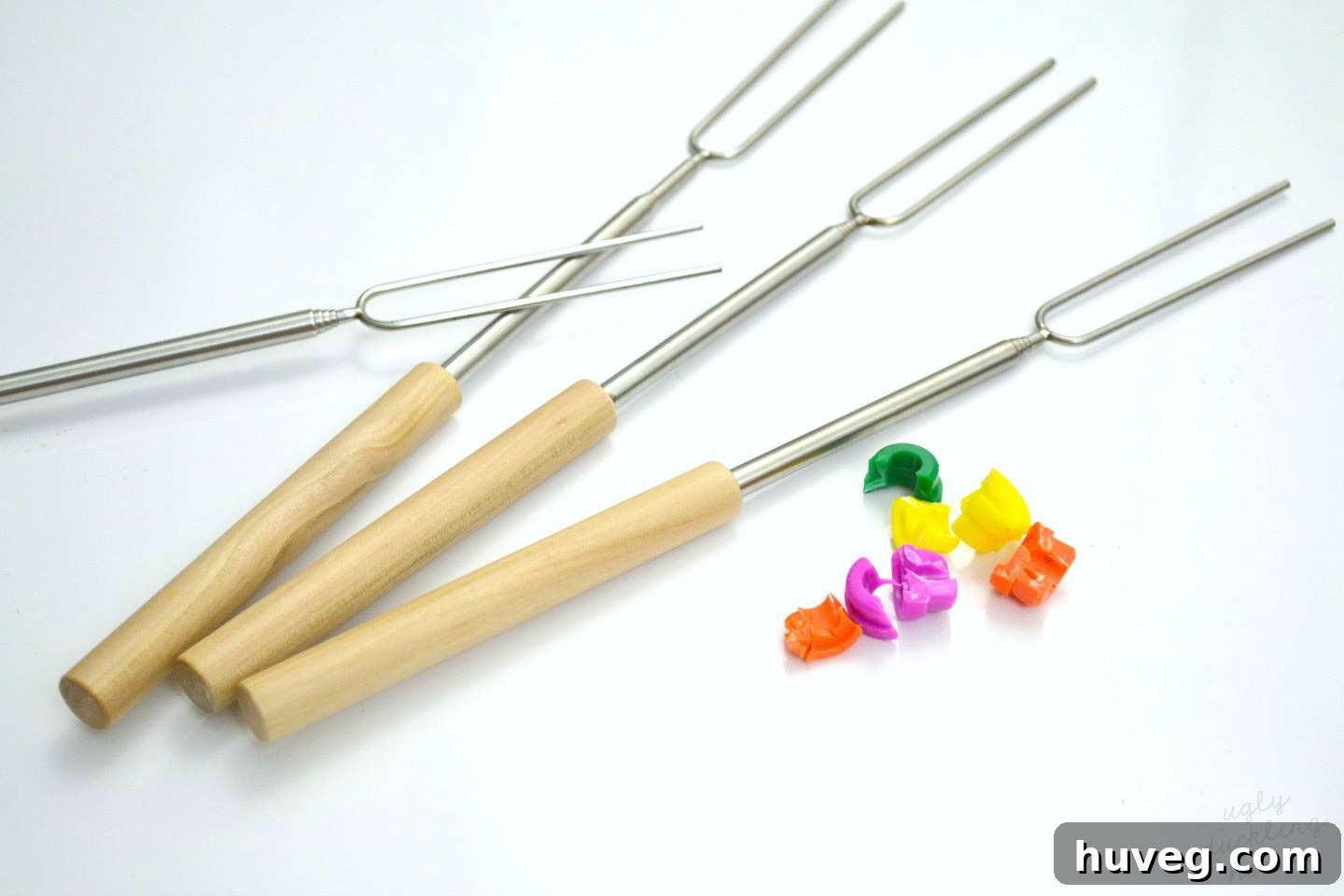 Roasting sticks with plastic caps successfully removed, ready for customization