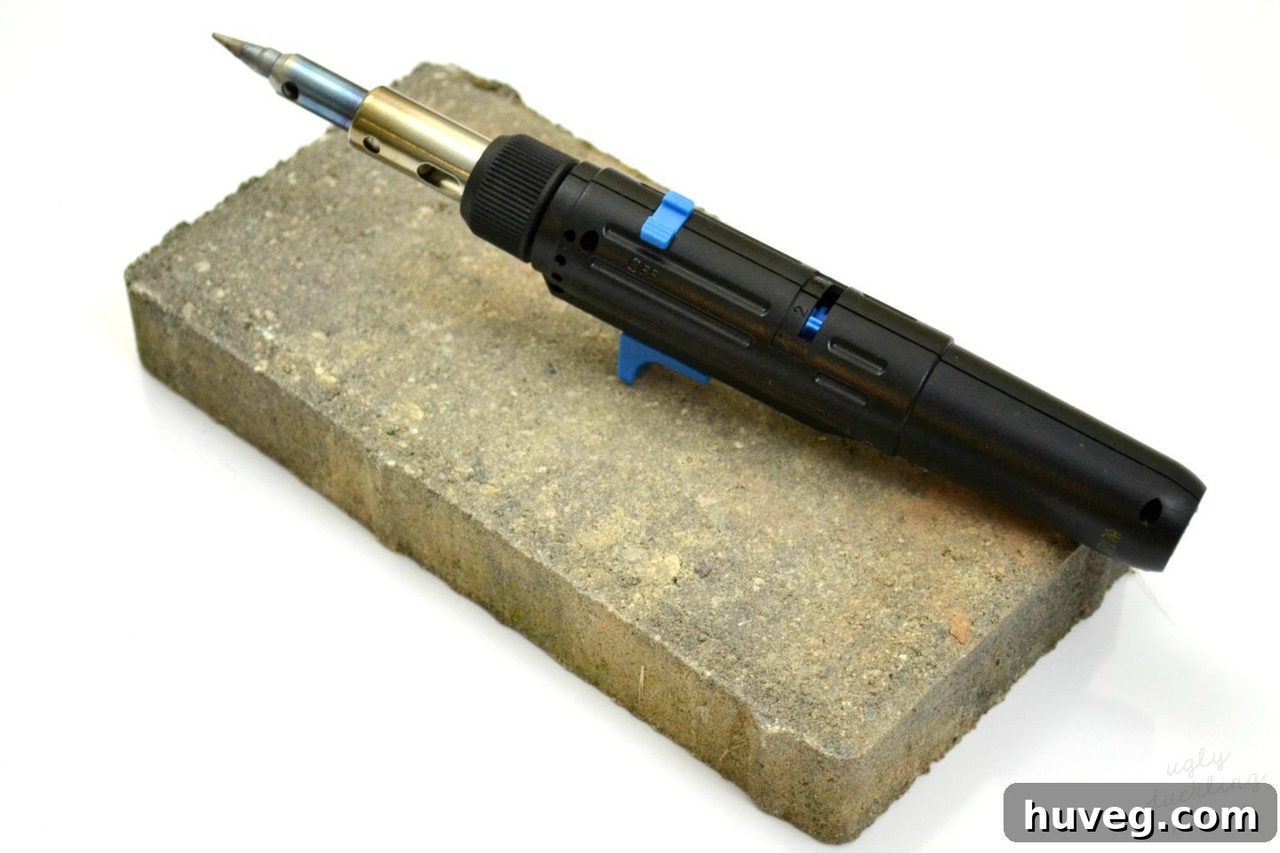 Resting a hot soldering iron on a brick for safety while heating up and cooling down