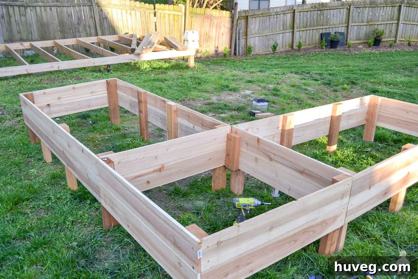 raised garden beds before digging into the ground - pub shed foundation in background