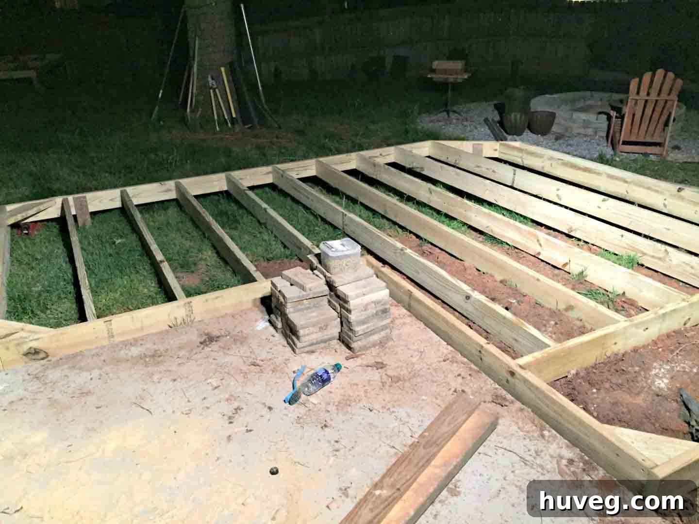 floating deck at night - base frame of ground level deck