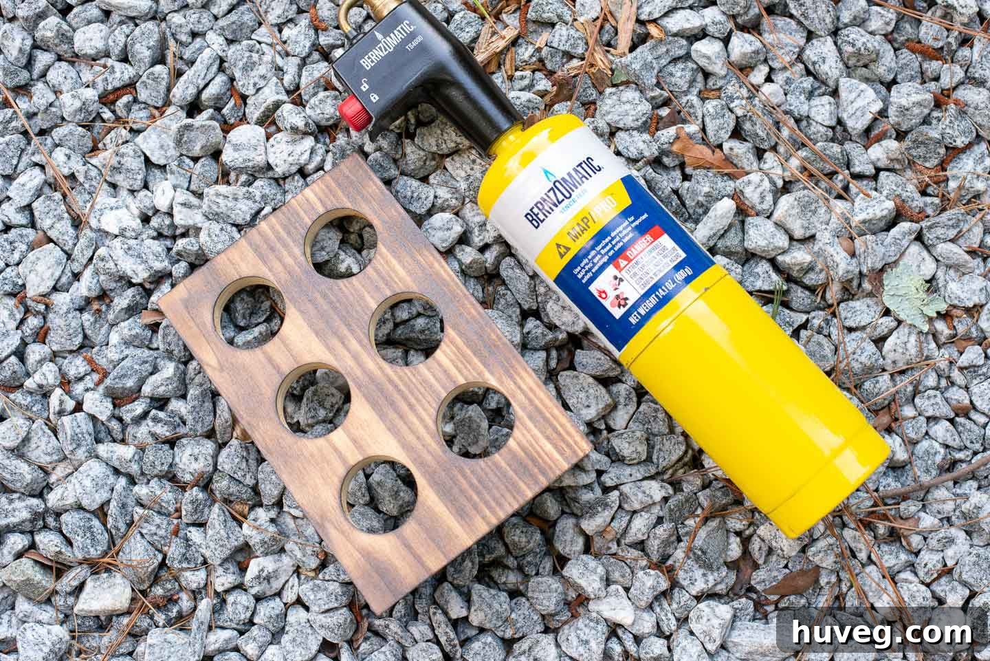 burned wood on gravel and bernzomatic high heat torch