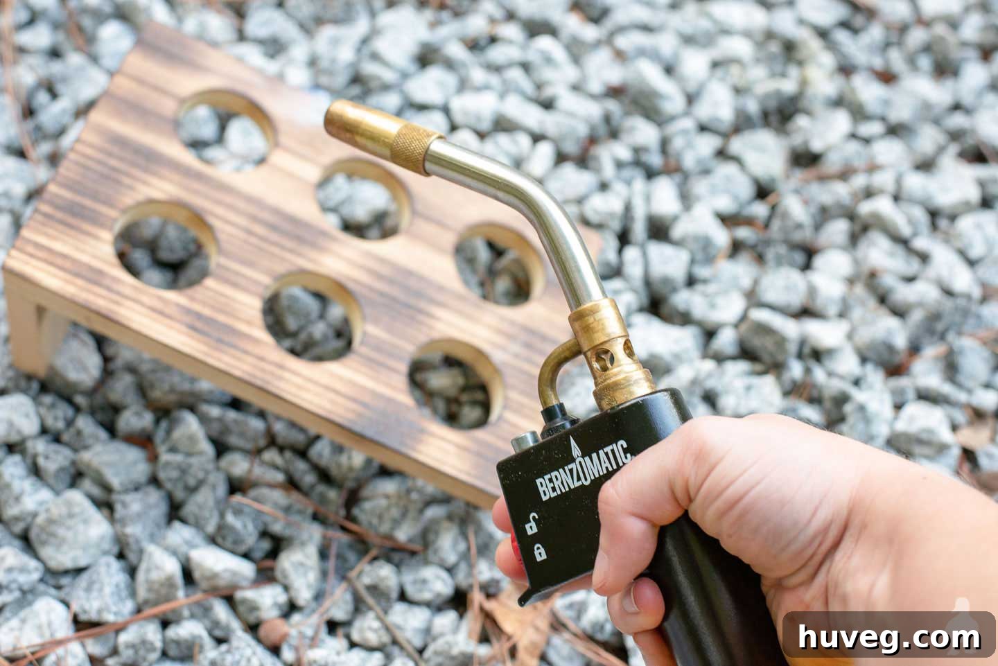 Holding bernzomatic torch next to freshly burned wood 
