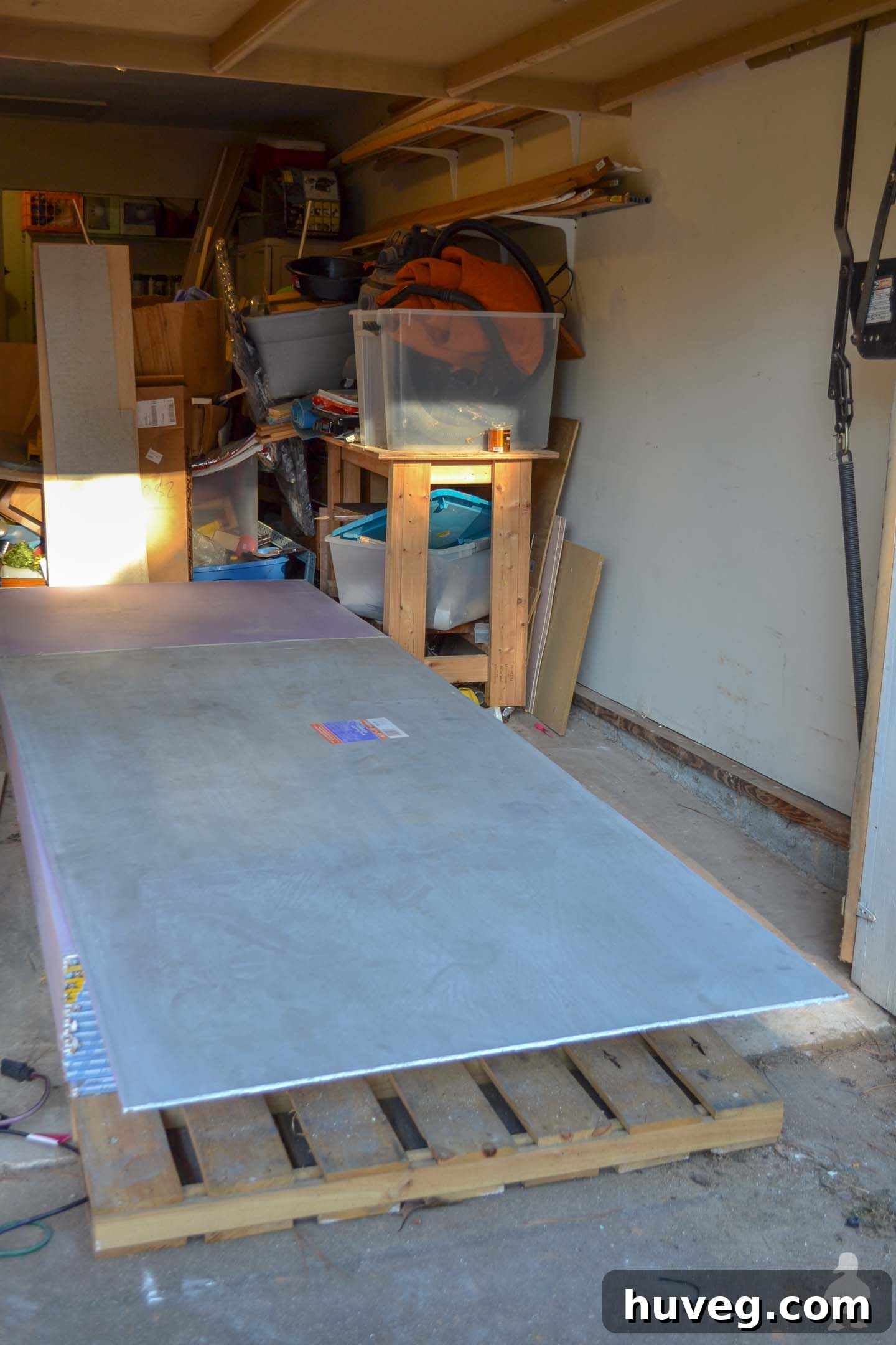super long pallet of drywall in garage