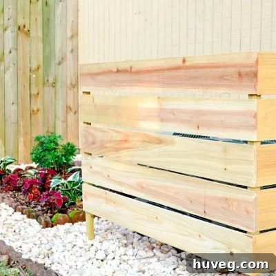 DIY wood screen designed to discreetly hide an outdoor air conditioning unit, improving backyard aesthetics