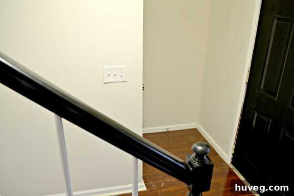 A serene and bright hallway after painting, illustrating the significant increase in natural light and sense of spaciousness, a successful home improvement.