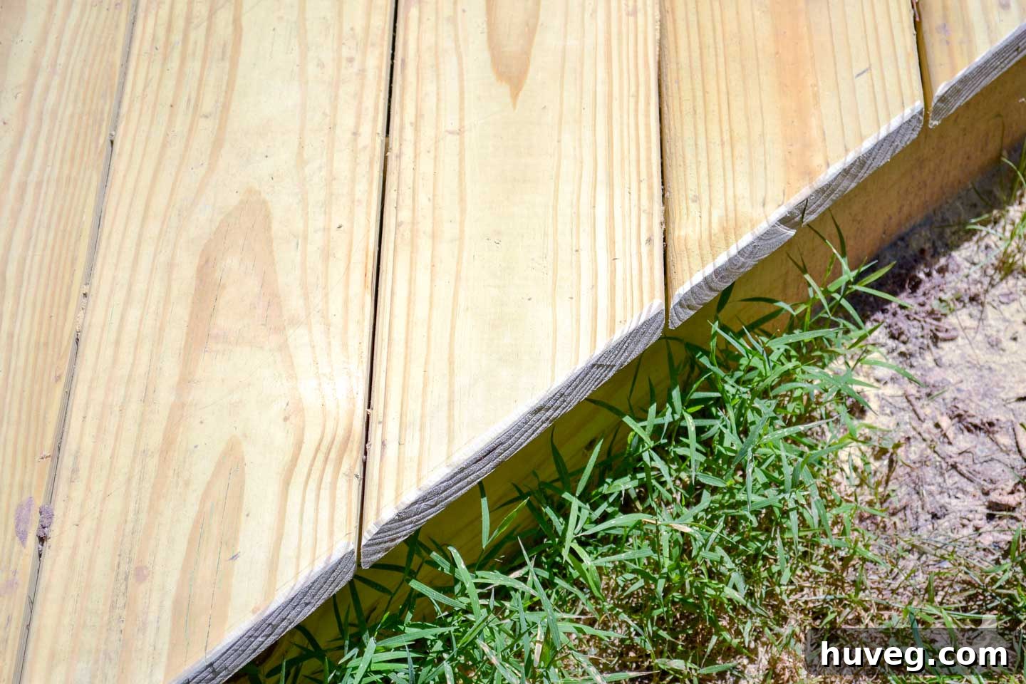 side of deck after cutting off deck overhang and chamfering the edge