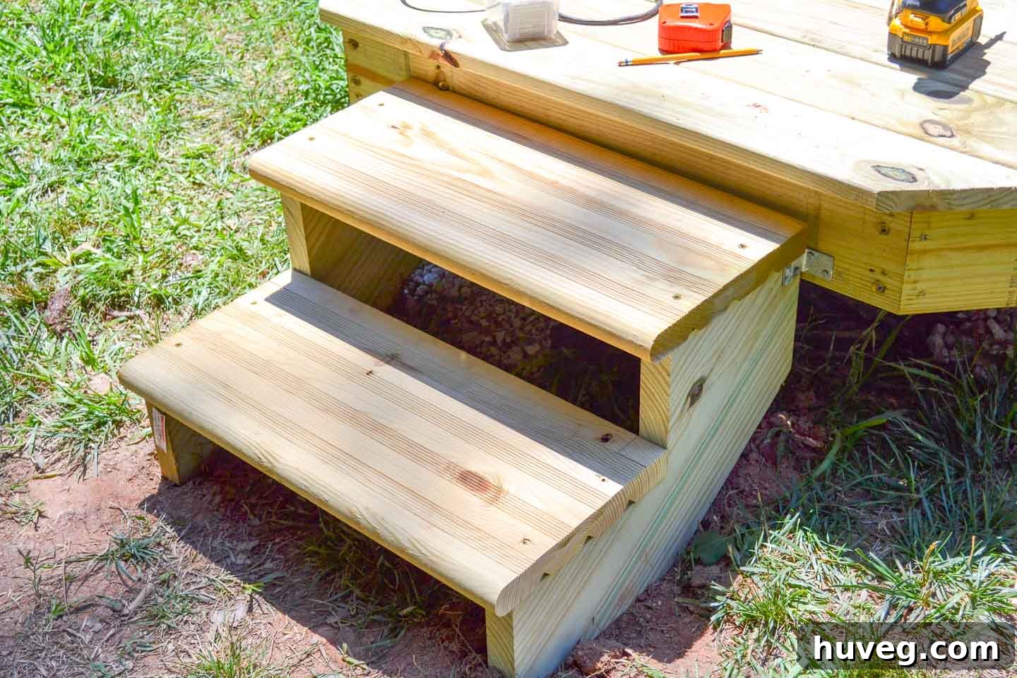 small deck stairs at corner of custom diy floating deck