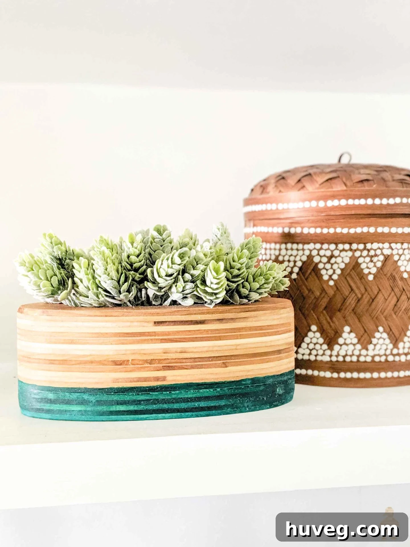 Stacked plywood planter with a stylish teal dip-dye accent, demonstrating a modern and unique woodworking technique.