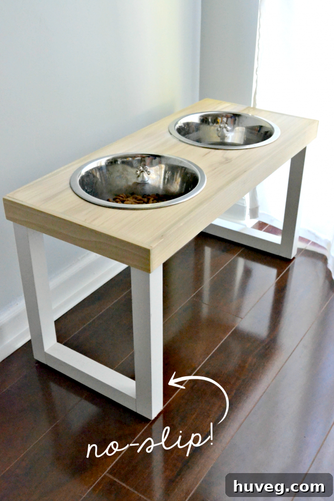 DIY no-slip elevated dog feeder station with two stainless steel bowls, designed to prevent spills and aid pet digestion.
