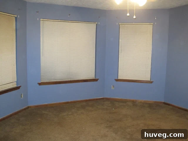 master bedroom original blue walls and brown carpet, dated interior design