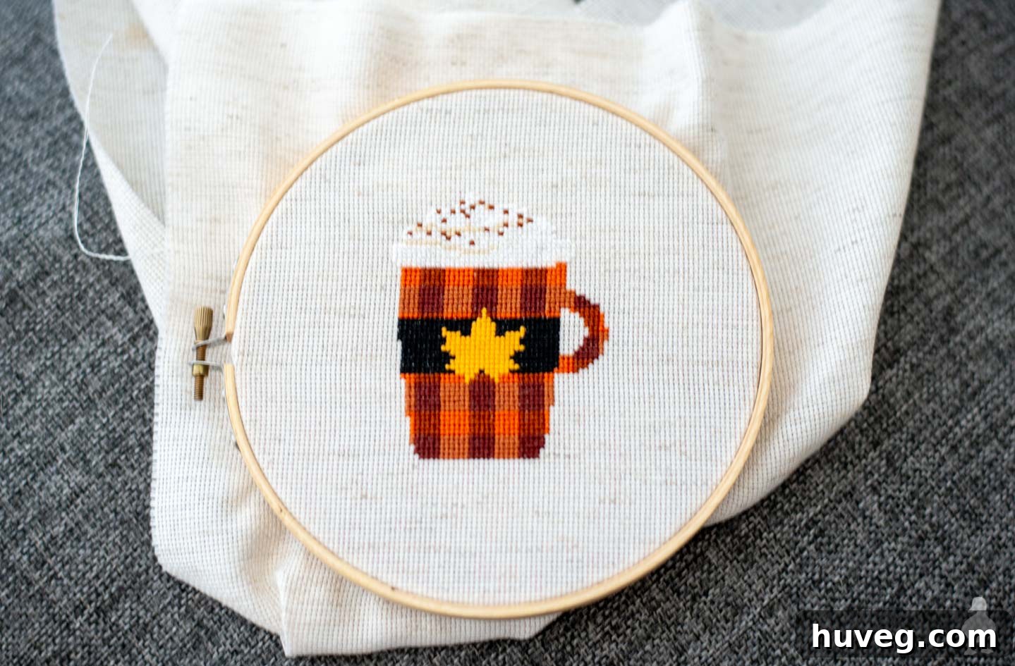 A finished PSL fall cross stitch pattern, ready for display.