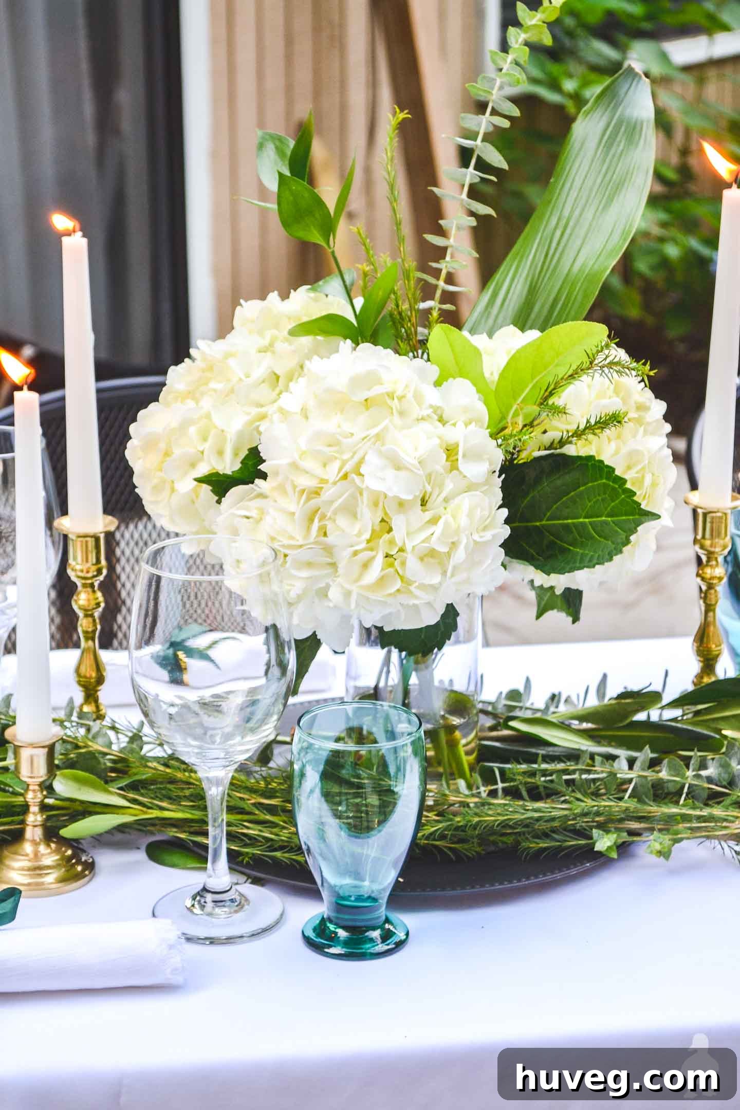 white hydrangea bouquet easy diy outdoor tablescape and green glasses